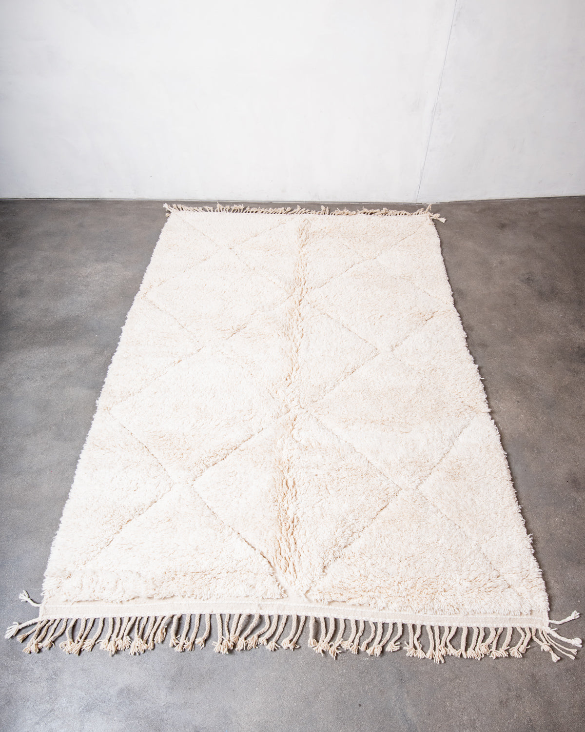 Modern, designer, handcrafted Berber rug from Morocco. Beniourain carpet with minimalist design, natural wool pile and a fluffy texture.